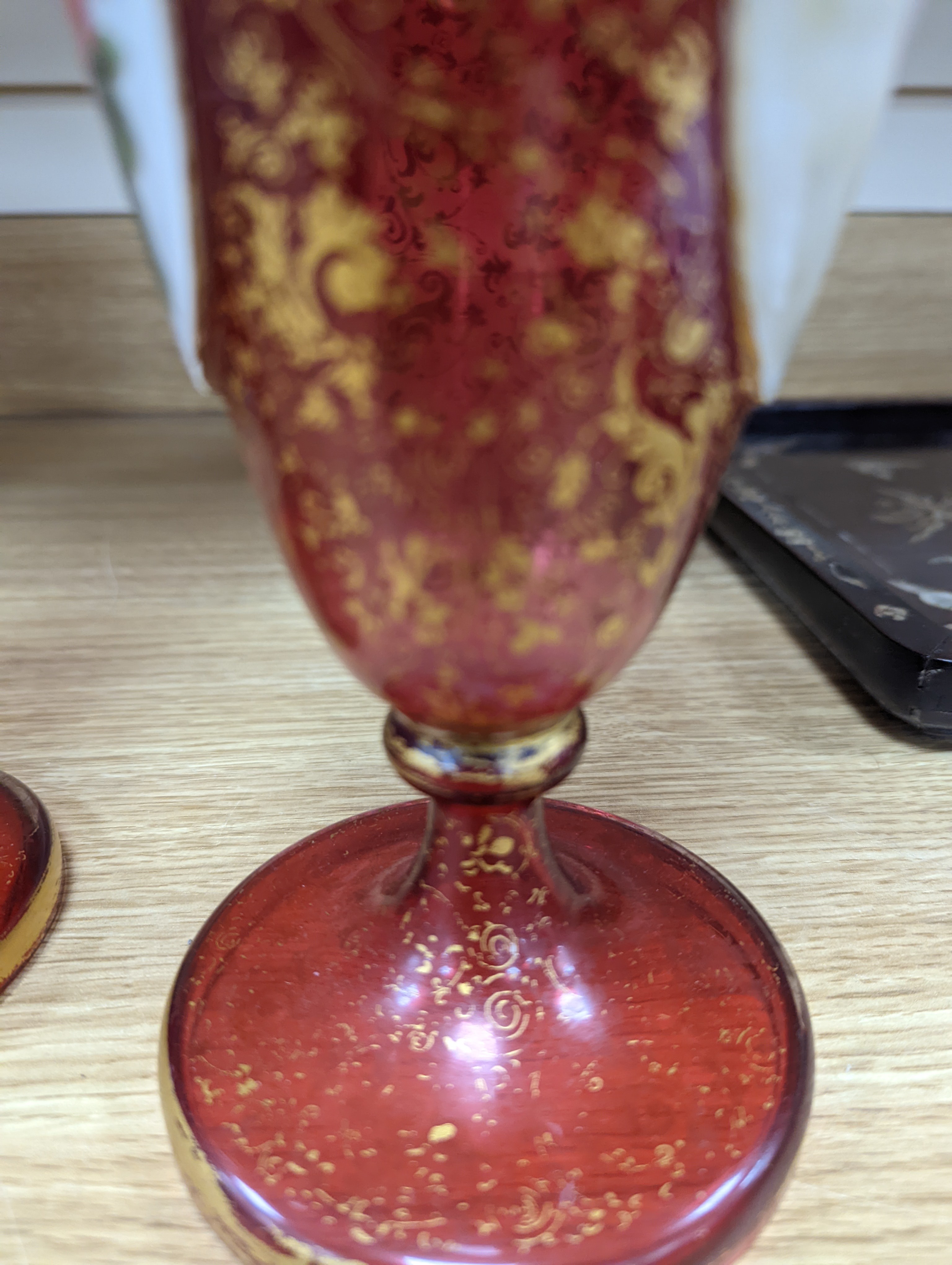 A pair of 19th century Bohemian enamelled and overlaid ruby glass vases 36cm